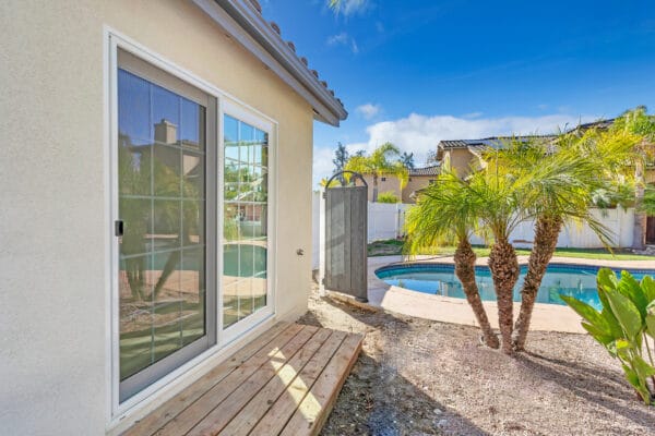 Snap-ADU-Vista-Amelia-4-br-3-ba-1200-sqft-Exterior-Poolside-Unit-Sliding-Glass-Doors-Landscaping-Tan-Stucco-600x400